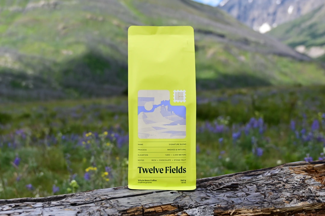 Signature Blend coffee bag overlooking a mountain lake in Montana
